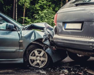 Close up smached cars on a road.